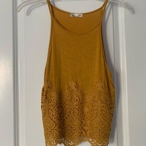 Mustard yellow tank. Size M. Good condition.